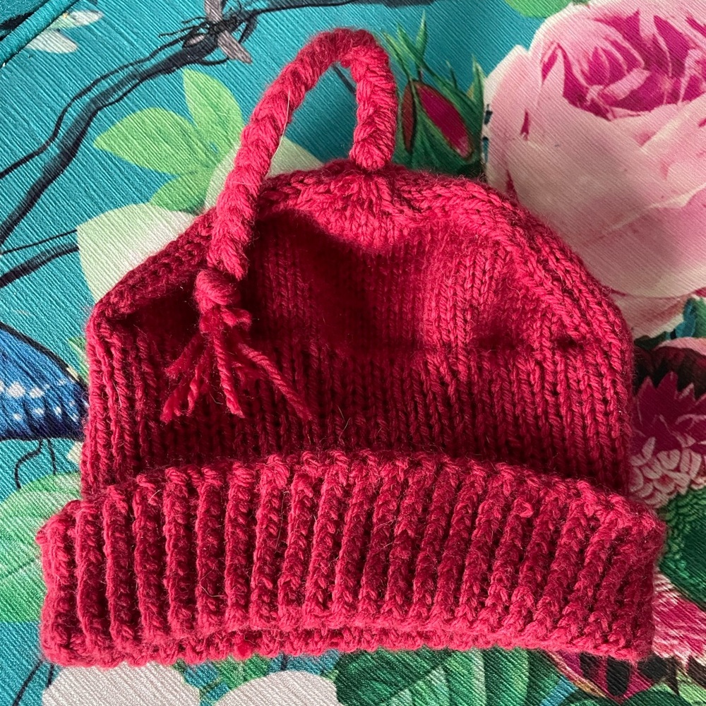 young child’s red Resistance Hat